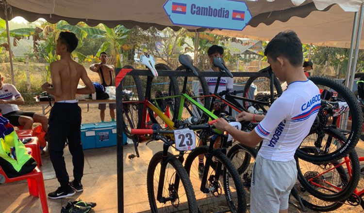 Cambodian cyclists prepare their bikes prior to the races. CCF