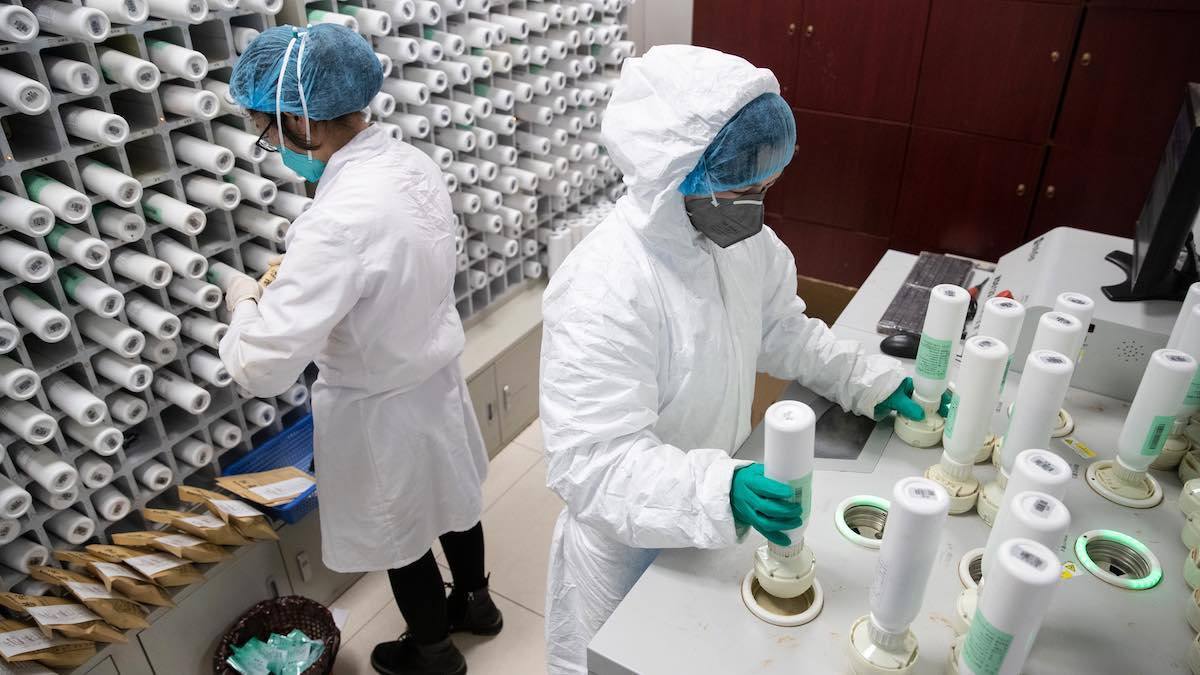 Medical staff mix traditional Chinese medicine to treat patients infected by Covid-19 at a hospital in Wuhan.
