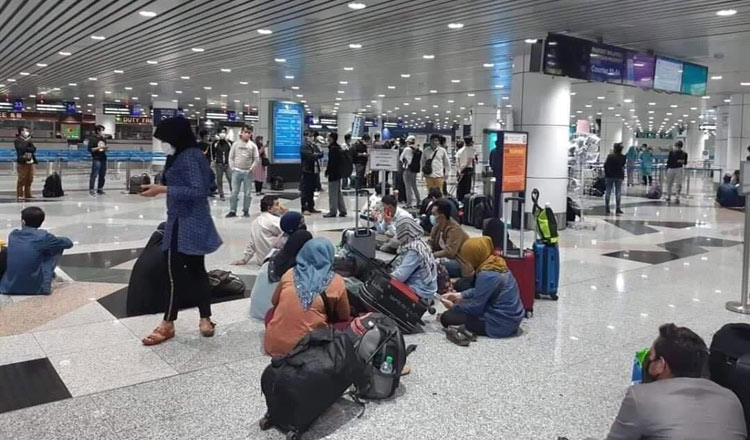 Migrant workers are stuck in a Malaysian airport. Cambodian Muslim Media Center