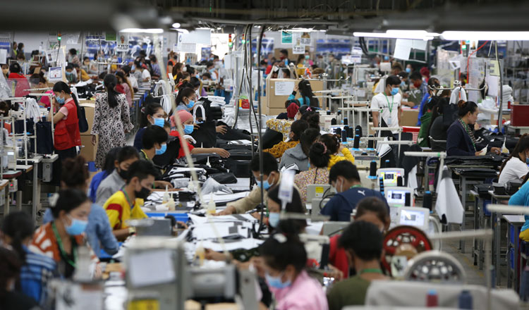 Garment workers at a factory during Khmer New Year for the first time ever. The government had to cancel this year’s New Year holidays over fears people going back to provinces could lead to a spike in COVID-19 cases. KT/Khem Sovannara